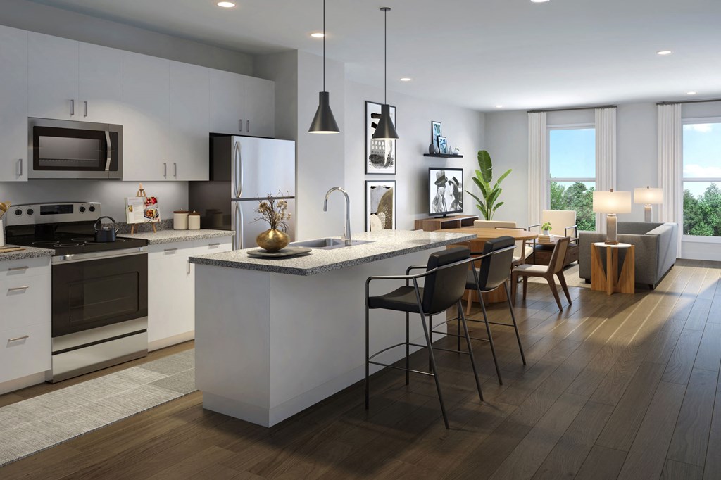 a kitchen with a large island and a table with chairs